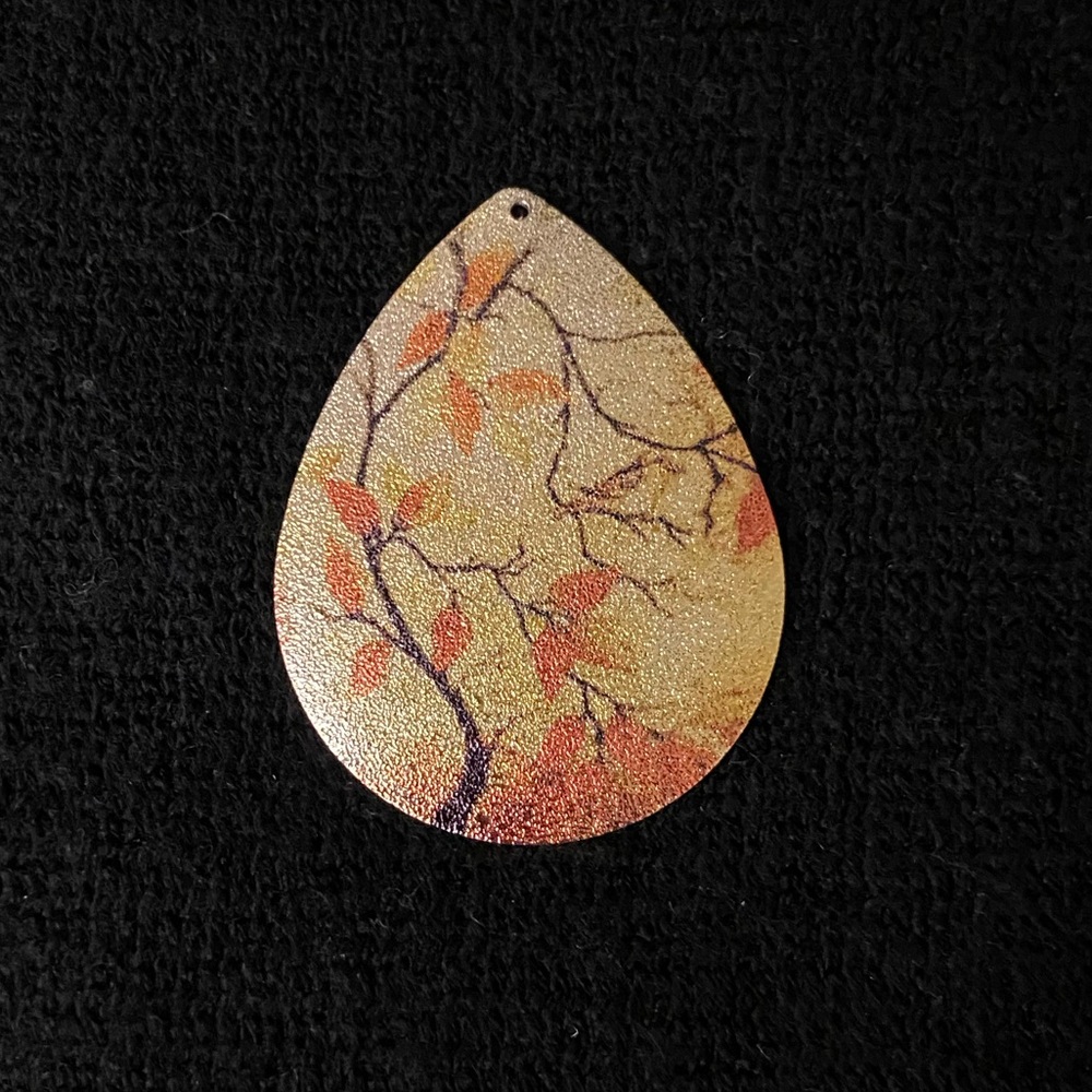 Thin metal Asian inspired tear drop shape charm